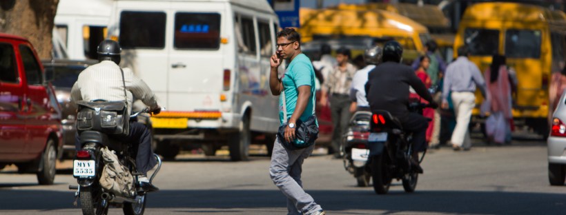 crossing street on phone