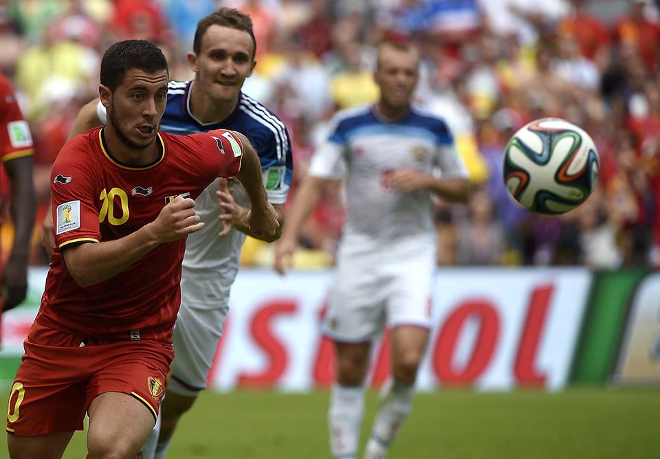 2014 FIFA World Cup - Belgium's Eden Hazard (L) vies for the ball with Russia's defender Aleksei Kozlov.