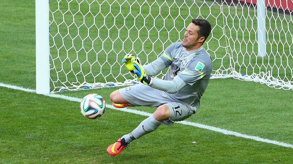 2014 FIFA World Cup - Brazil goalkeeper Julio Cesar saves Chile forward Mauricio Pinilla's penalty kick.