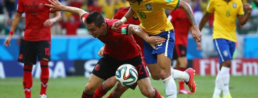 2014 FIFA World Cup - Brazil's Neymar battles for the ball with Aguilar