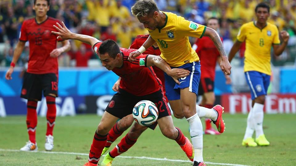 2014 FIFA World Cup - Brazil's Neymar battles for the ball with Aguilar