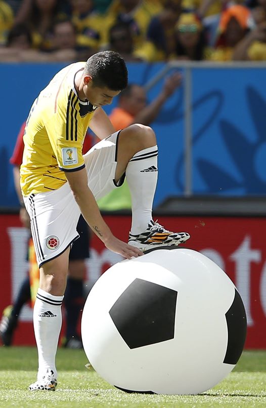 Colombia 0 vs. 0 Cote d'Ivoire - Colombia's James Rodriguez deflates an inflatable football.