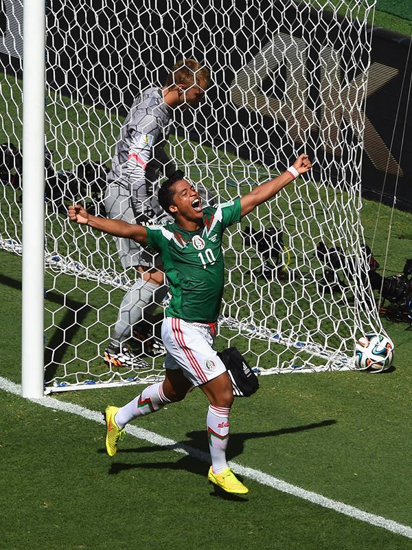 2014 FIFA World Cup - Mexico's Giovani dos Santos celebrates scoring the opening goal against the Netherlands
