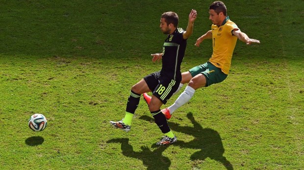 2014 FIFA World Cup - Spain defender Jordi Alba vies for the ball with Australia's Mathew Leckie.