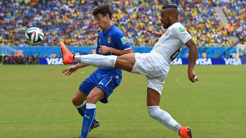 2014 FIFA World Cup - Uruguay's Alvaro Pereira vies for the ball with Italy's Matteo Darmian.