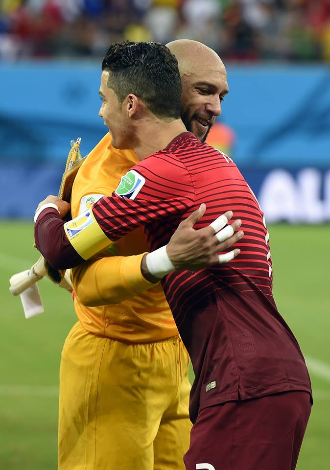 2014 FIFA World Cup - US goalkeeper Tim Howard (L) hugs Portugal's forward Cristiano Ronaldo