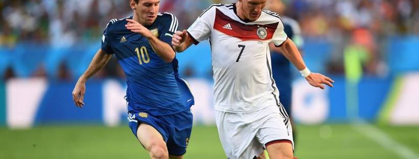 2014 FIFA World Cup - Argentina captain Lionel Messi and Germany midfielder Bastian Schweinsteiger vie for the ball.