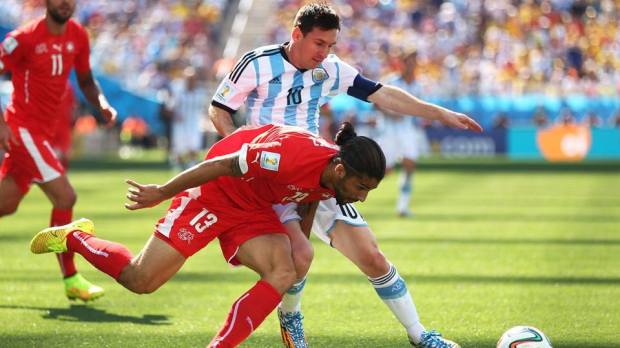 2014 FIFA World Cup - Argentina captain Lionel Messi challenges Switzerland's Ricardo Rodriguez.