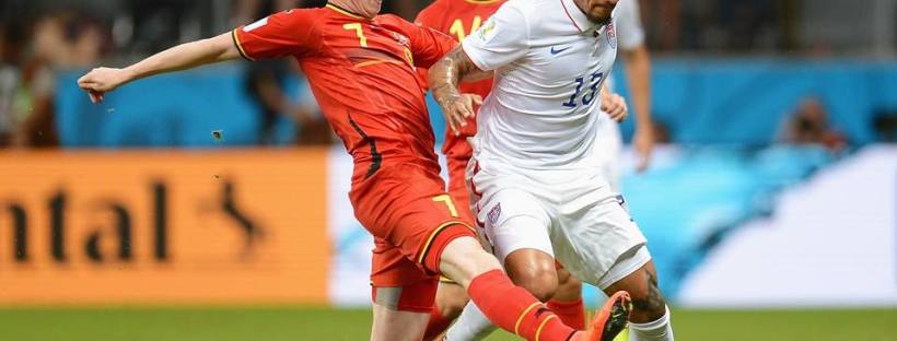 2014 FIFA World Cup - Belgium midfielder Kevin De Bruyne challenges USA midfielder Jermaine Jones.