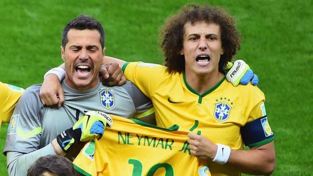 2014 FIFA World Cup - Brazil captain David Luiz and goalkeeper Julio Cesar hold Neymar's shirt during the singing of the national anthem.