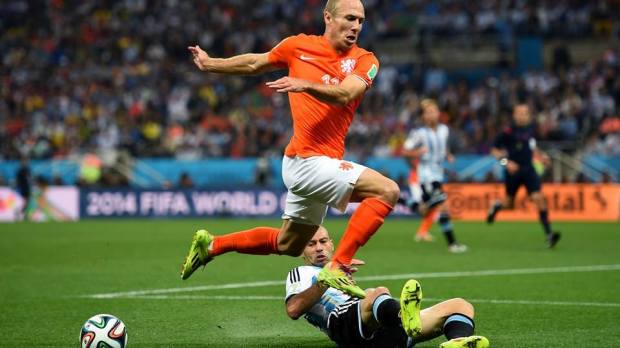 2014 FIFA World Cup - Netherlands forward Arjen Robben is challenged by Javier Mascherano of Argentina.