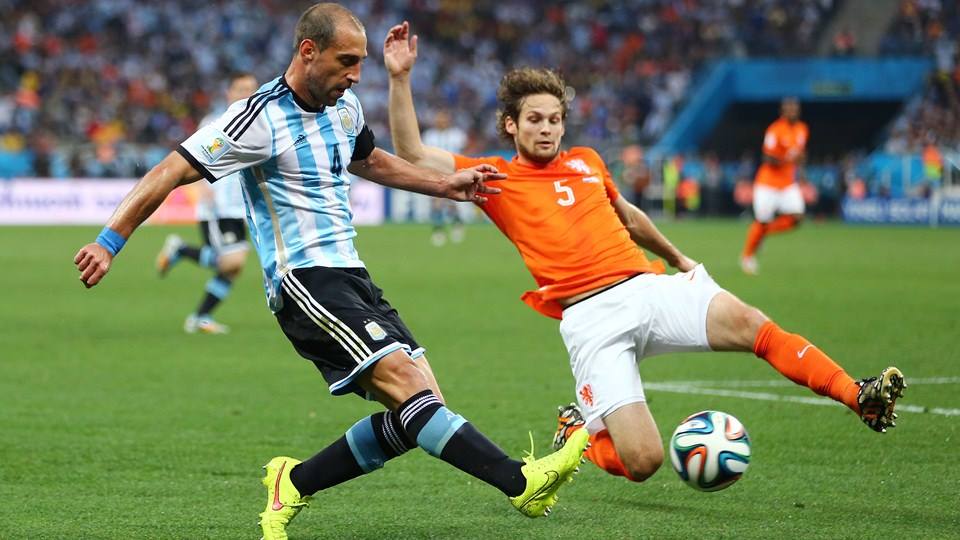 2014 FIFA World Cup - Pablo Zabaleta of Argentina is challenged by Netherlands defender Daley Blind.