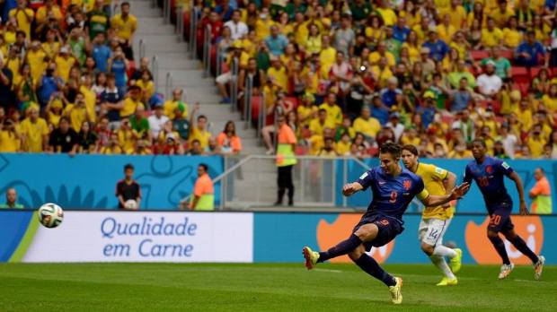 2014 FIFA World Cup - Robin van Persie of the Netherlands scores his team's first goal from the penalty spot