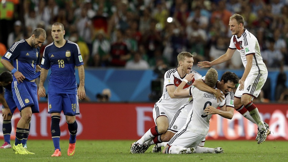 German players celebrate their 1-0 World Cup victory in extra time during the final soccer match between Germany and Argentina